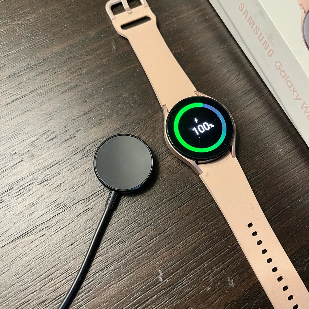New Galaxy Watch #4 Samsung Bluetooth-Wi-Fi- GPS with pink and black bands.